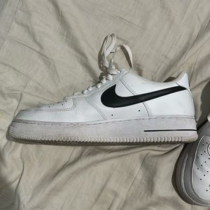 Nike Air Force 1’s with black Nike swoosh